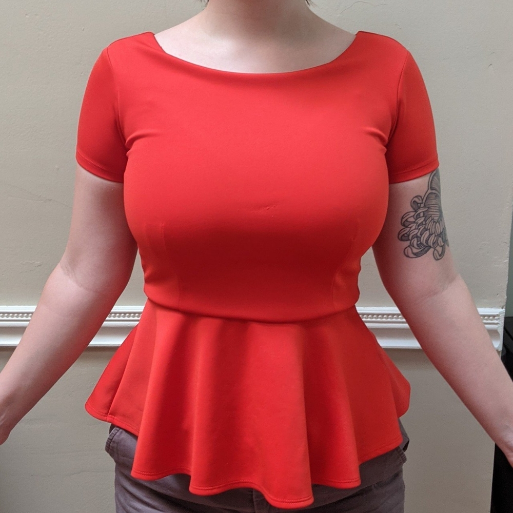 Cute cherry red peplum top by Bisou Bisou.